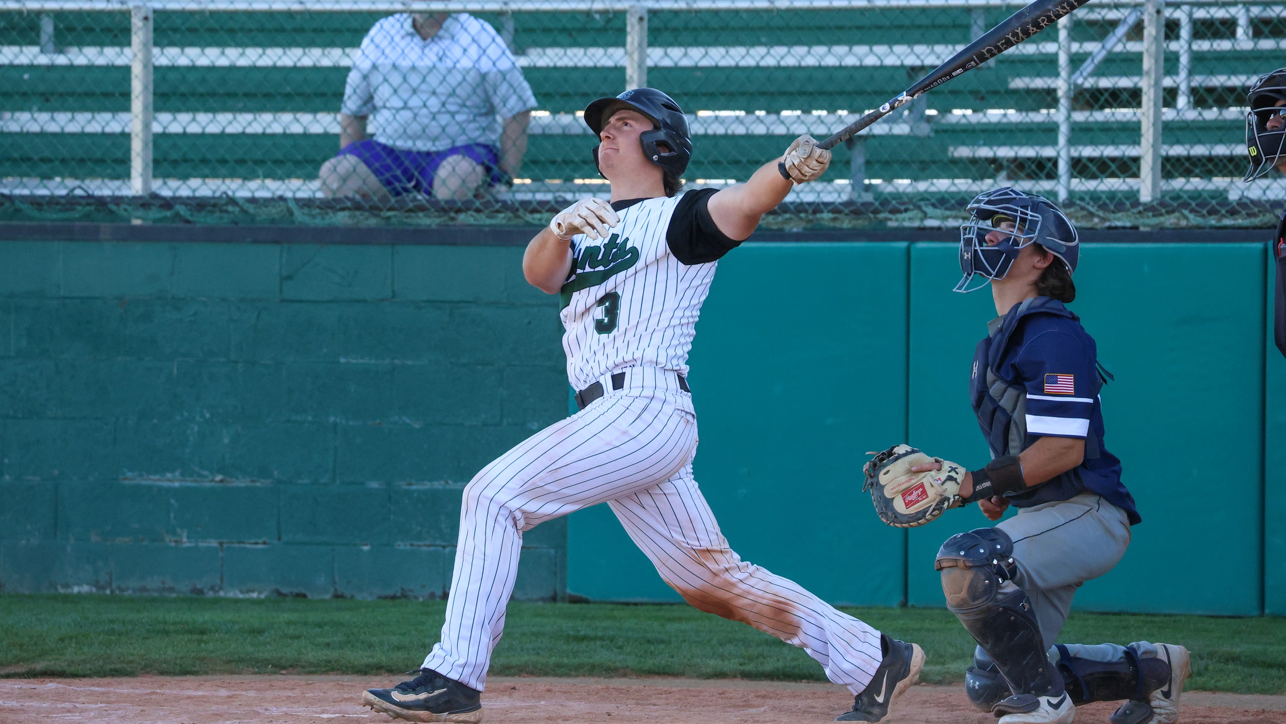 Mason Gilbert watches the ball on his walk off grand slam in Seward's game two win over Colby