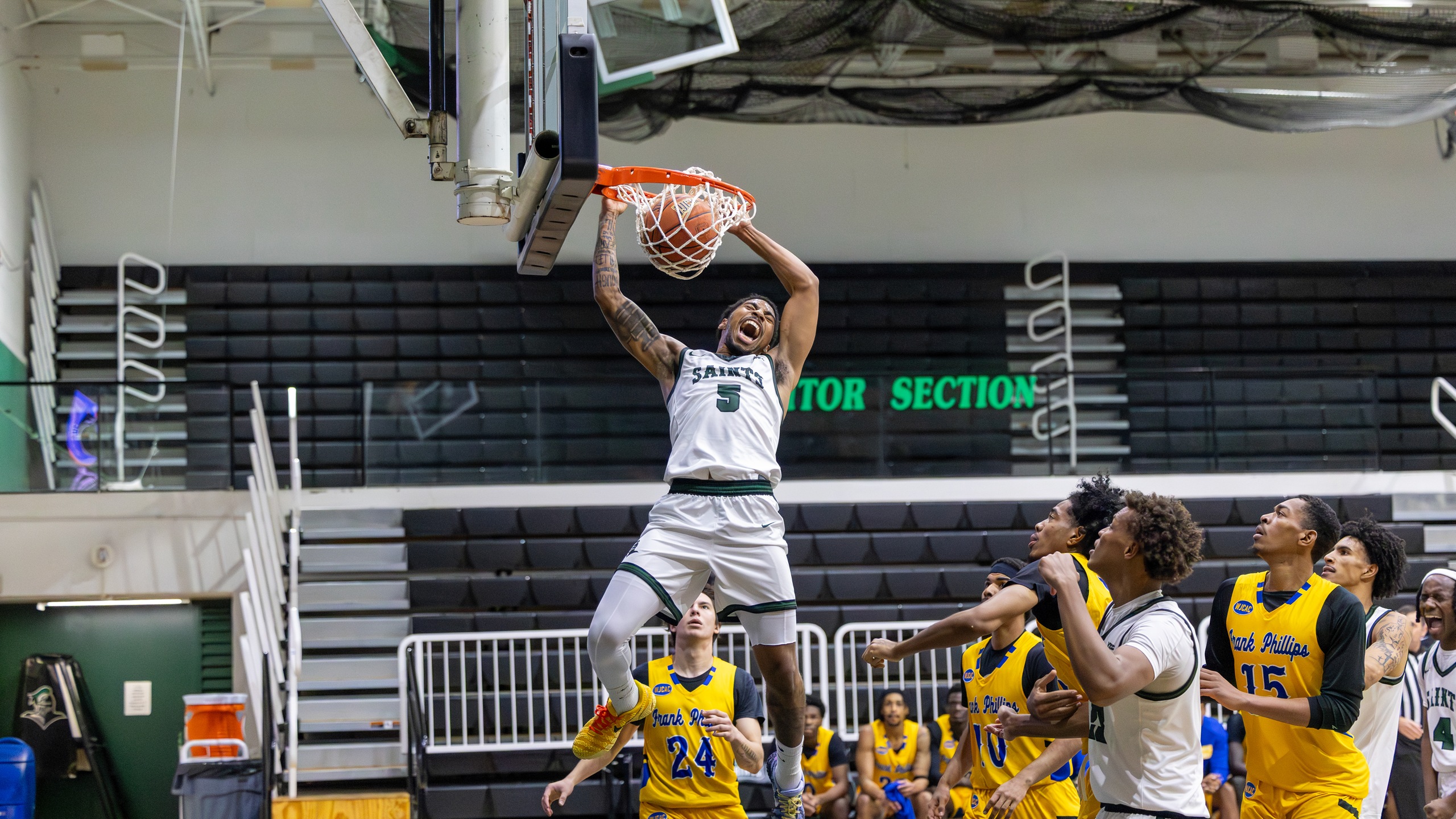 Lyna Brooks Jr. slams home one of his two emphatic first half dunks in Seward's 81-68 win over Frank Phillips on Tuesday