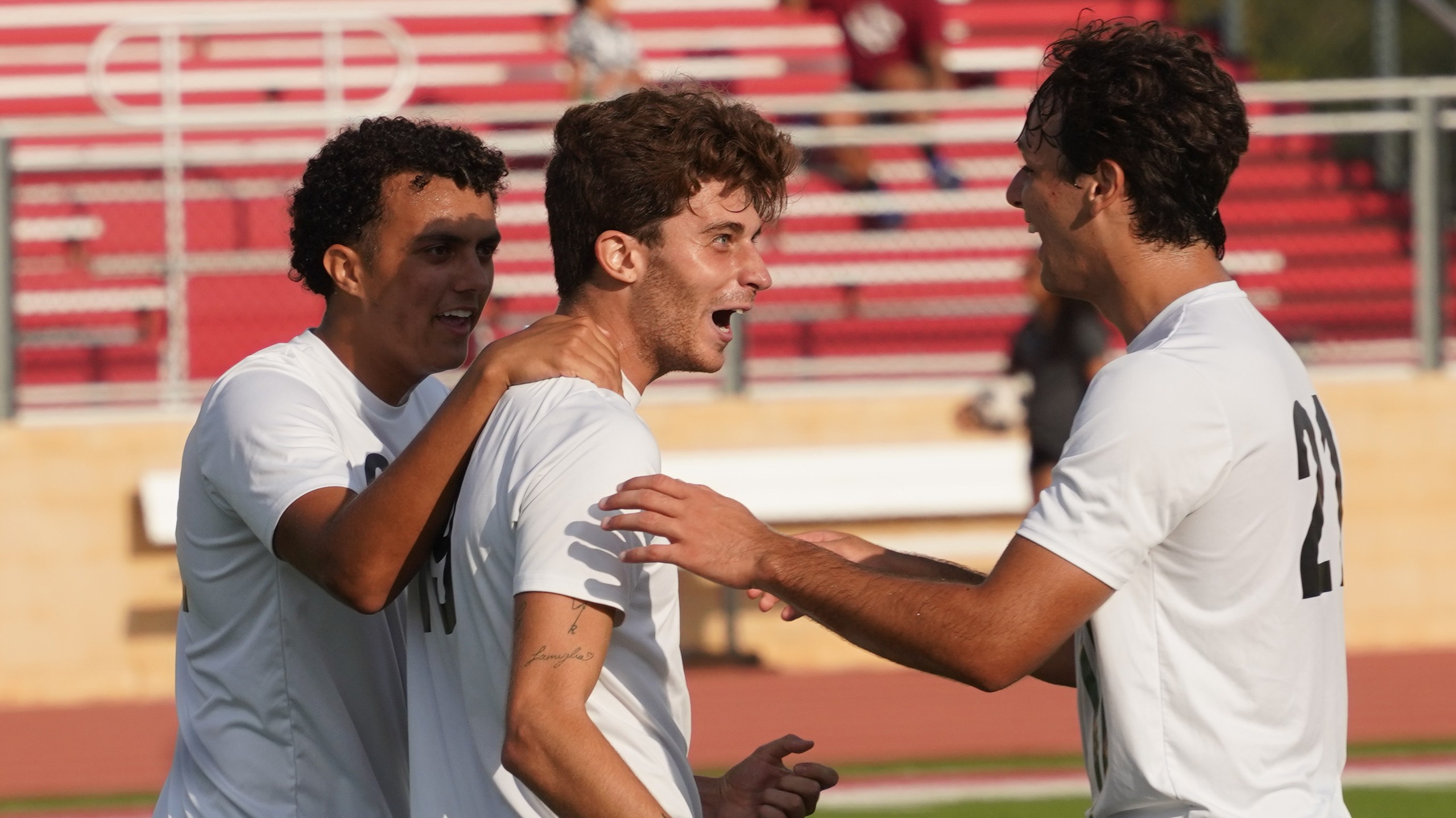 Sophomore forward Enrico De Lellis celebrates after one of his two goals in the first half of Seward's 3-0 win over Tabor at Redskin Field